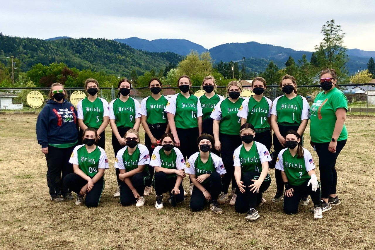 Softball team with coaches