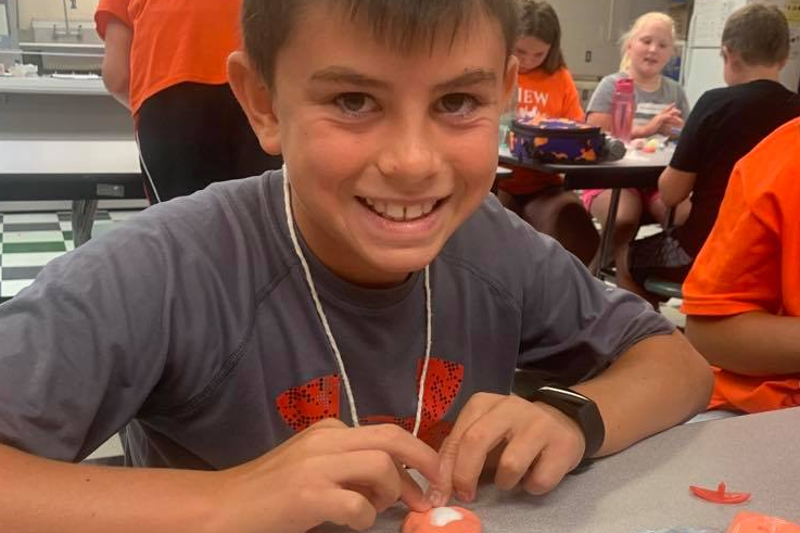 Camper shows his creativity with air drying clay.