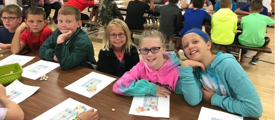 Students sitting in the cafeteria together