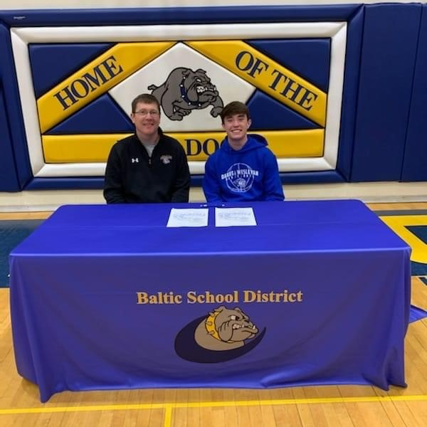 Alex Haagenson and Coach Alex Langer at signing for DWU.