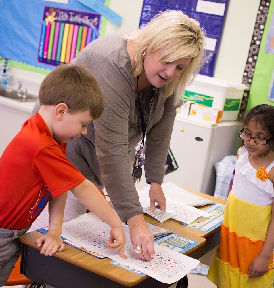 Teacher helping student