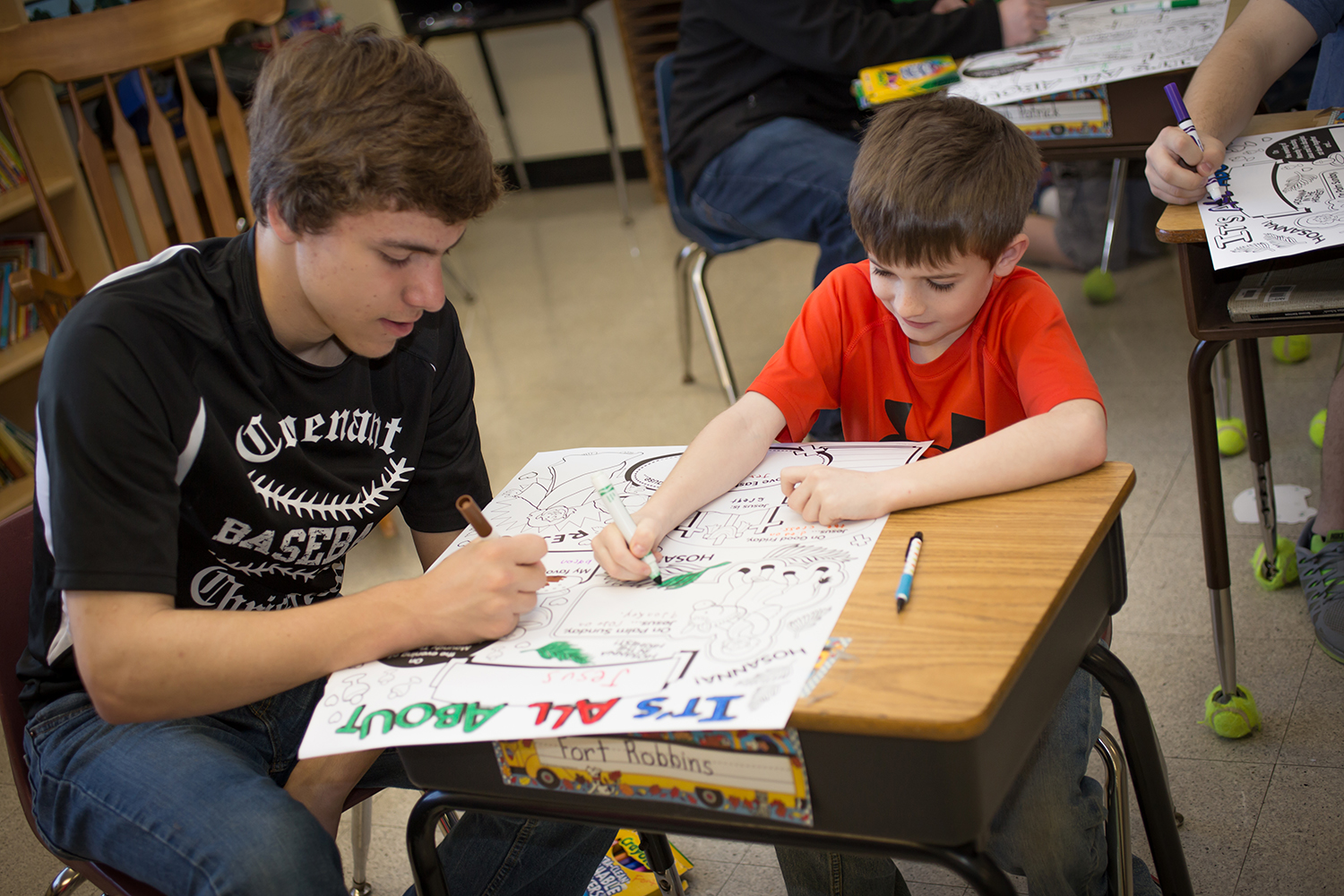 Student helping another