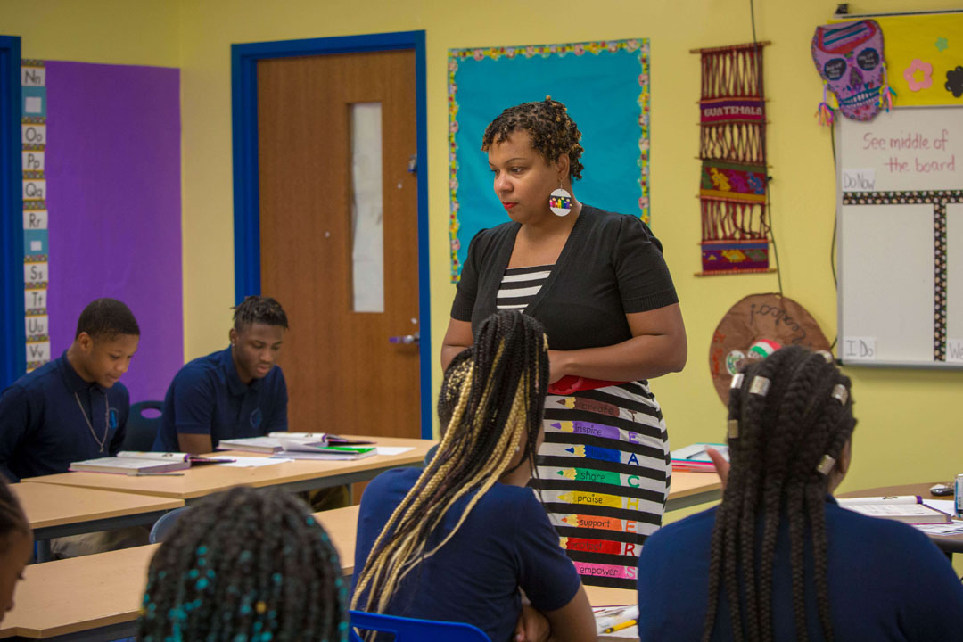 Teacher in classroom looking at students