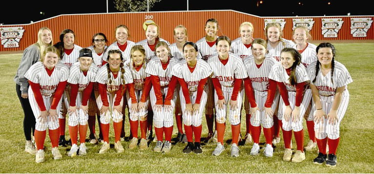 Softball team posing with championship title