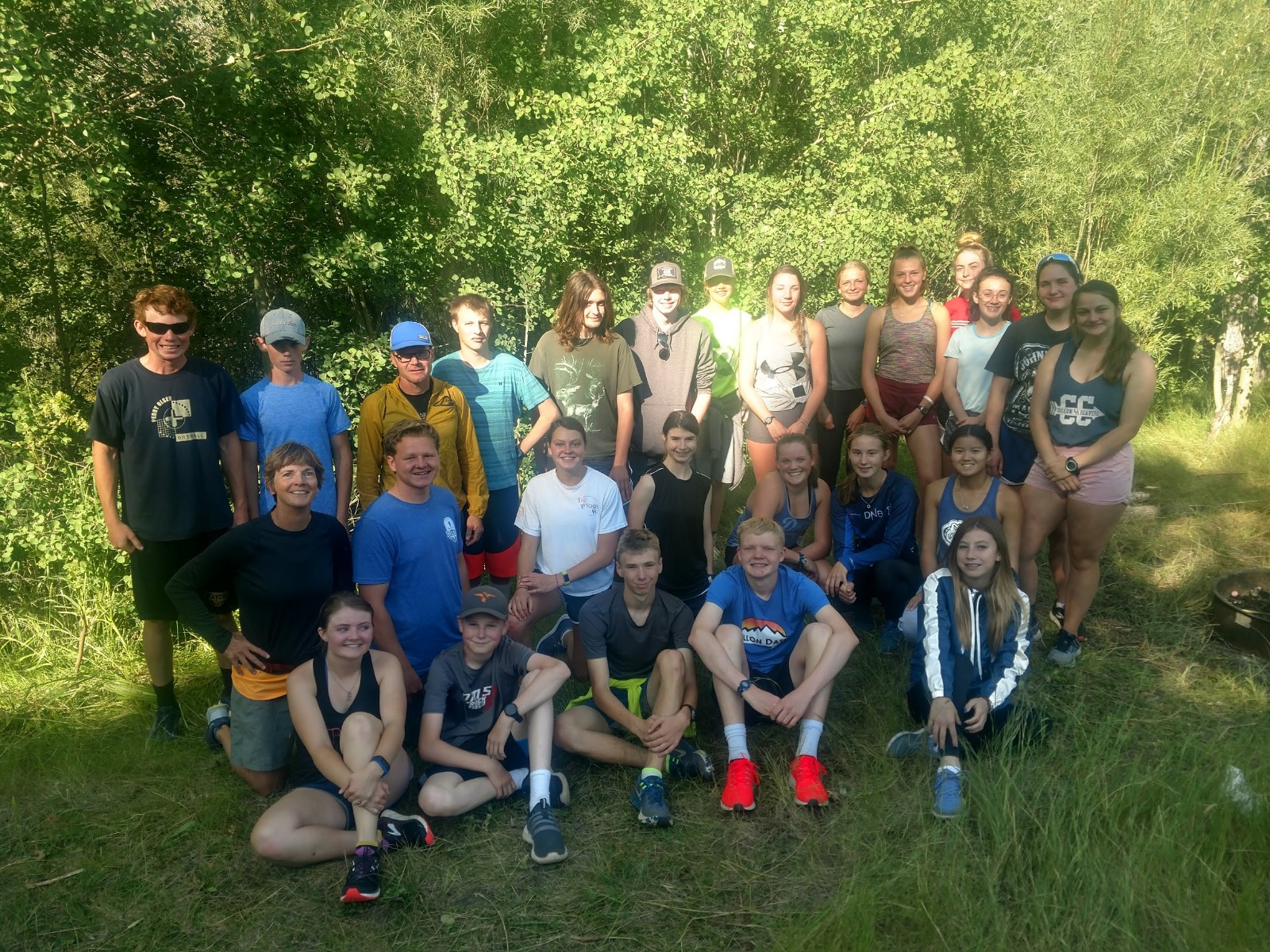 A photo of the Cross Country team outside