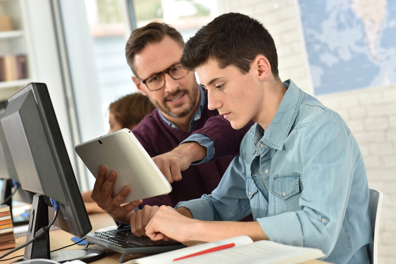 Teacher helping a student