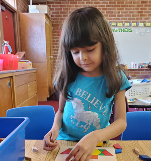 Girls doing a puzzle