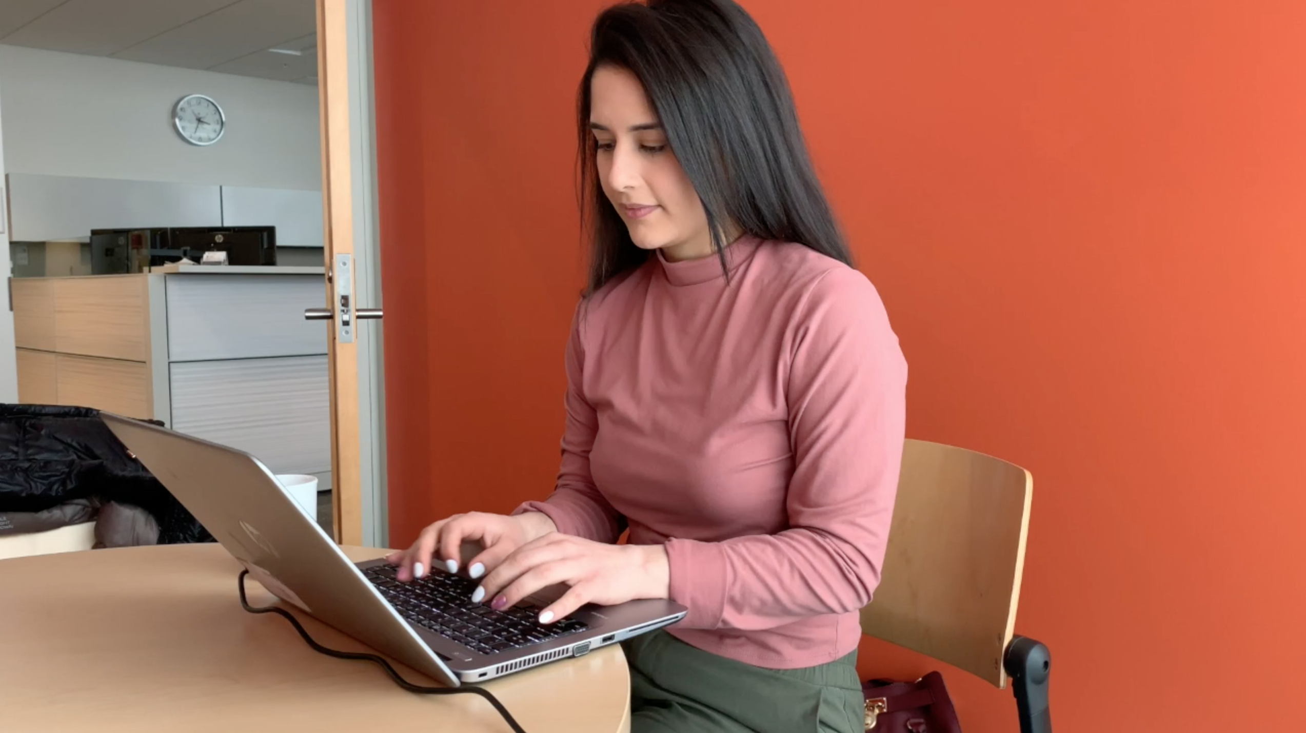 A gril working on her computer