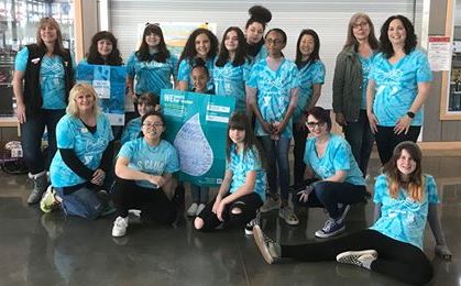 A group of girls dressed up in blue